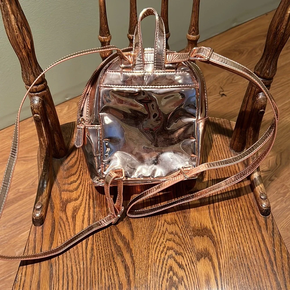 Guess Faux Leather Small  Backpack In A Shiny Rose Gold Colored